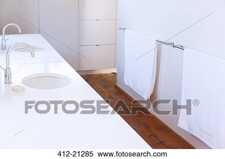 Towels, sinks and faucets in modern bathroom View Large Photo Image Stock Photography - Towels, sinks and faucets in modern bathroom. Fotosearch