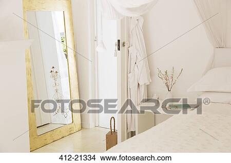 Window, bed, door, and bedside table in modern bedroom View Large Photo Image Picture - Window, bed, door, and bedside table in modern bedroom. Fotosearch