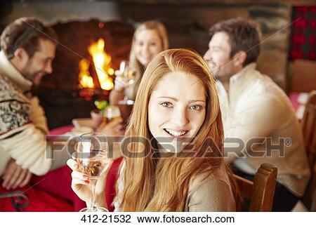 Woman enjoying drinks with friends View Large Photo Image Stock Image - Woman enjoying drinks with friends. Fotosearch