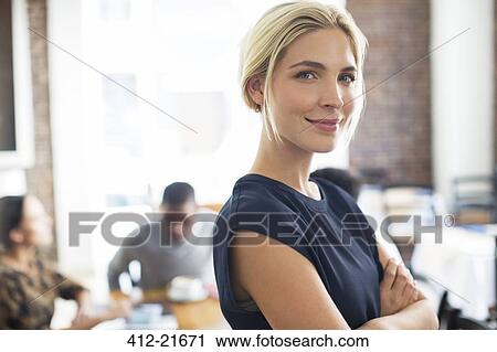 Stock Image - Woman smiling in cafe. Fotosearch