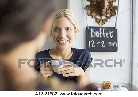 Women having coffee together in cafe View Large Photo Image Stock Image - Women having coffee together in cafe. Fotosearch