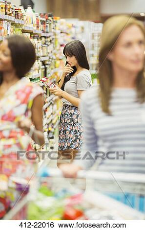 Stock Photograph - Women shopping in grocery store. Fotosearch