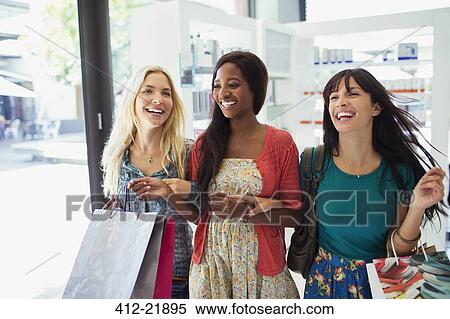 Stock Photography - Women shopping together in drugstore. Fotosearch