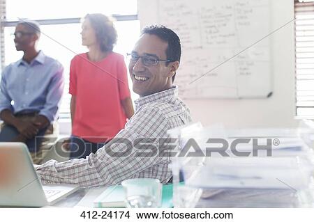 Picture - Business people working in office. Fotosearch