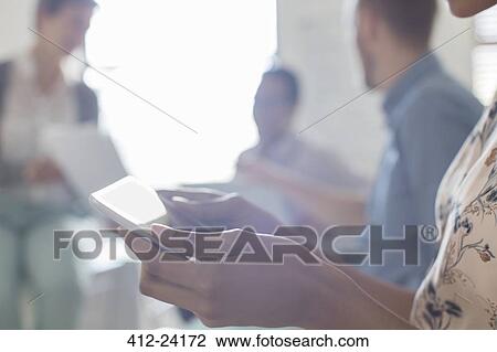 Business people working in office, using digital tablets View Large Photo Image Stock Image - Business people working in office, using digital tablets. Fotosearch