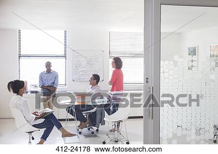 Business people working in office View Large Photo Image Stock Photo - Business people working in office. Fotosearch