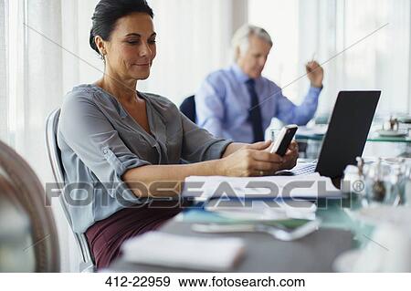 Stock Photo - Business people working in restaurant. Fotosearch