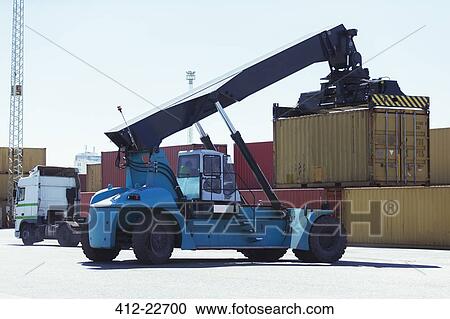 Crane lifting cargo container View Large Photo Image Stock Image - Crane lifting cargo container. Fotosearch