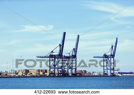 Cranes and cargo containers at waterfront View Large Photo Image Stock Image - Cranes and cargo containers at waterfront. Fotosearch