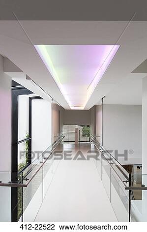 Empty corridor in modern building with colored lighting above View Large Photo Image Stock Image - Empty corridor in modern building with colored lighting above. Fotosearch