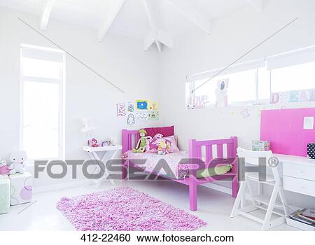 Girl's bedroom with pink bed, rug and toys View Large Photo Image Stock Image - Girl's bedroom with pink bed, rug and toys. Fotosearch