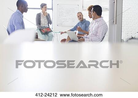 Stock Image - Group of business people having meeting in modern in office. Fotosearch