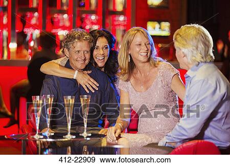 Group of friends having fun in bar View Large Photo Image Stock Photo - Group of friends having fun in bar. Fotosearch