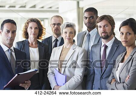 Group portrait of successful office team standing in office View Large Photo Image Picture - Group portrait of successful office team standing in office. Fotosearch