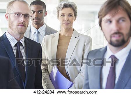 Group portrait of successful office team standing in office View Large Photo Image Picture - Group portrait of successful office team standing in office. Fotosearch