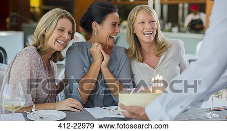 Mature women celebrating birthday View Large Photo Image Stock Photo - Mature women celebrating birthday. Fotosearch
