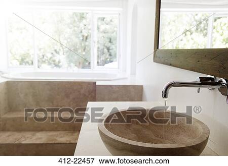 Modern bathroom interior with stone sink and bathtub View Large Photo Image Stock Photo - Modern bathroom interior with stone sink and bathtub. Fotosearch