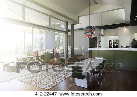 Stock Photo - Modern dinning room interior with large table and chairs. Fotosearch