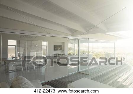 Modern house interior with glass doors View Large Photo Image Stock Image - Modern house interior with glass doors. Fotosearch