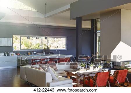 Modern house interior with living room en suited with kitchen View Large Photo Image Stock Image - Modern house interior with living room en suited with kitchen. Fotosearch