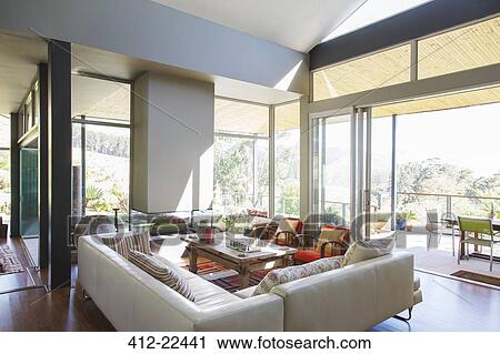 Modern living room with large sofas and coffee table View Large Photo Image Stock Image - Modern living room with large sofas and coffee table. Fotosearch