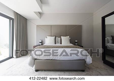 Modern white and beige bedroom with double bed View Large Photo Image Stock Image - Modern white and beige bedroom with double bed. Fotosearch