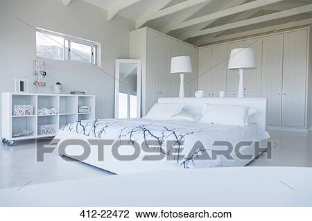 Modern white bedroom interior with double bed View Large Photo Image Stock Image - Modern white bedroom interior with double bed. Fotosearch