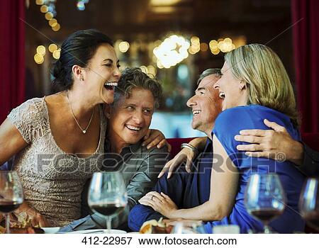 Stock Photo - People having fun in restaurant. Fotosearch