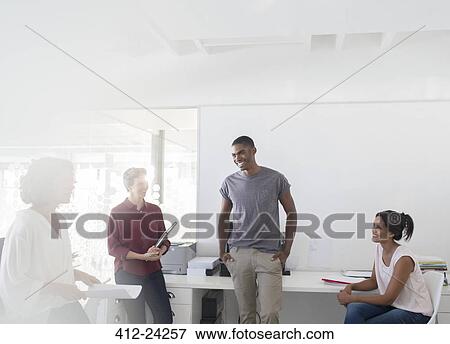 Stock Photo - People having meeting in office. Fotosearch