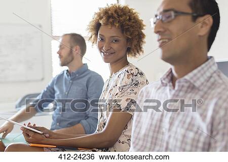 Stock Photograph - People having meeting in office. Fotosearch