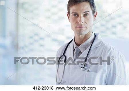 Stock Photo - Portrait of confident doctor wearing lab coat. Fotosearch