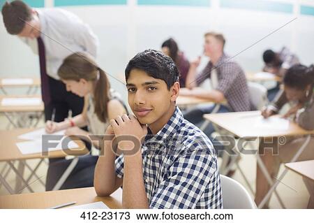 Portrait of confident student during his GCSE examination View Large Photo Image Stock Image - Portrait of confident student during his GCSE examination. Fotosearch