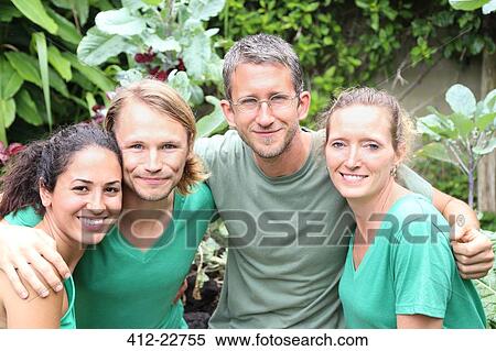 Portrait of four men and women wearing green t-shirts in garden View Large Photo Image Stock Photography - Portrait of four men and women wearing green t-shirts in garden. Fotosearch