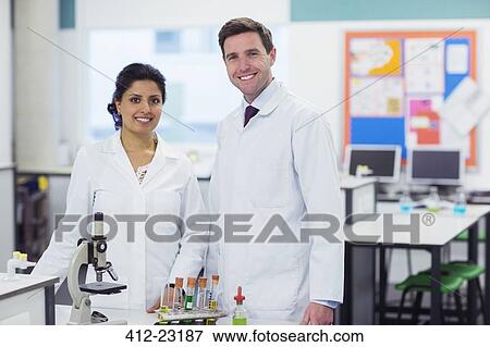 Portrait of two smiling teachers in chemistry lab View Large Photo Image Stock Photo - Portrait of two smiling teachers in chemistry lab. Fotosearch