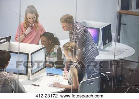 Smiling students learning in computer room View Large Photo Image Stock Image - Smiling students learning in computer room. Fotosearch