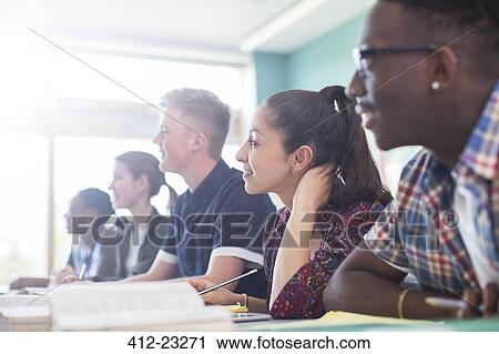 Stock Image - Students in classroom during lesson. Fotosearch