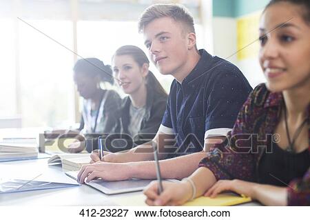 Stock Photo - Students sitting in classroom during lesson. Fotosearch