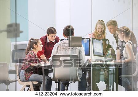 Students working with computers behind glass door View Large Photo Image Picture - Students working with computers behind glass door. Fotosearch