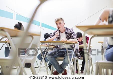 Students writing their GCSE exam in classroom View Large Photo Image Stock Image - Students writing their GCSE exam in classroom. Fotosearch