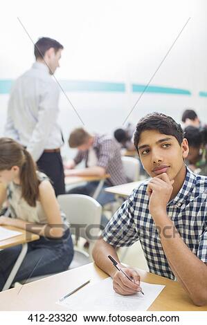 Students writing their GCSE exam in classroom View Large Photo Image Stock Image - Students writing their GCSE exam in classroom. Fotosearch