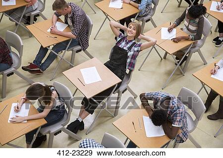 Students writing their GCSE exam in classroom View Large Photo Image Stock Photo - Students writing their GCSE exam in classroom. Fotosearch