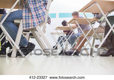 Students writing their GCSE exam in classroom View Large Photo Image Stock Photo - Students writing their GCSE exam in classroom. Fotosearch