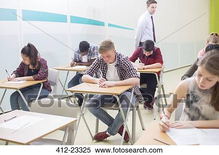 Students writing their GCSE exam in classroom View Large Photo Image Stock Photography - Students writing their GCSE exam in classroom. Fotosearch