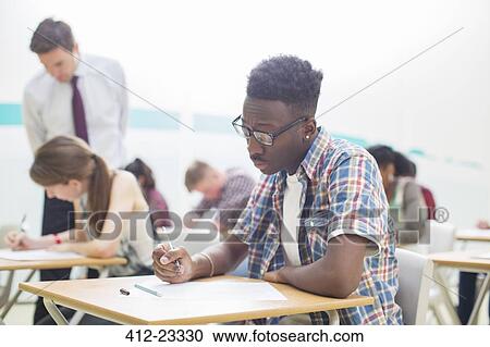 Students writing their GCSE exam View Large Photo Image Stock Image - Students writing their GCSE exam. Fotosearch