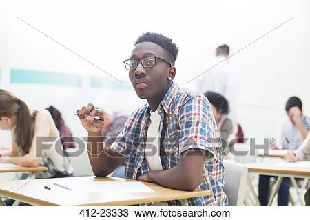 Students writing their GCSE exam View Large Photo Image Stock Image - Students writing their GCSE exam. Fotosearch