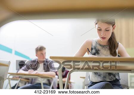 Students writing their GCSE examination View Large Photo Image Stock Photo - Students writing their GCSE examination. Fotosearch
