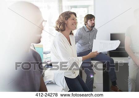 Team having meeting in office View Large Photo Image Stock Photo - Team having meeting in office. Fotosearch