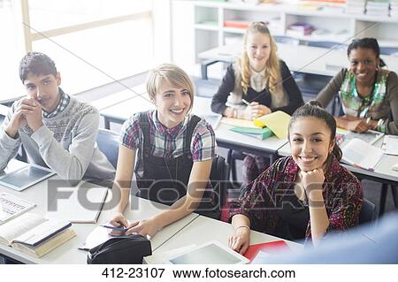 Stock Photo - Teenage students learning in classroom. Fotosearch
