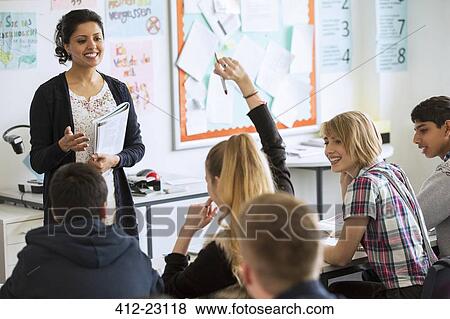 Teenage students learning in classroom View Large Photo Image Stock Photo - Teenage students learning in classroom. Fotosearch