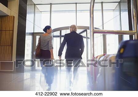 Woman and man shaking hands in restaurant View Large Photo Image Stock Image - Woman and man shaking hands in restaurant. Fotosearch